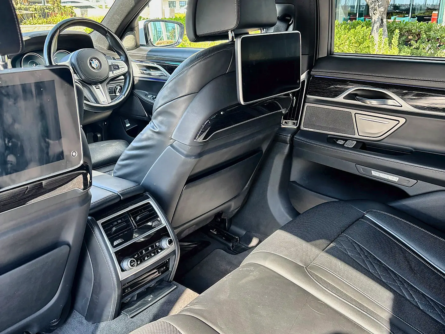 BMW 740e - rear seating with dual entertainment screens