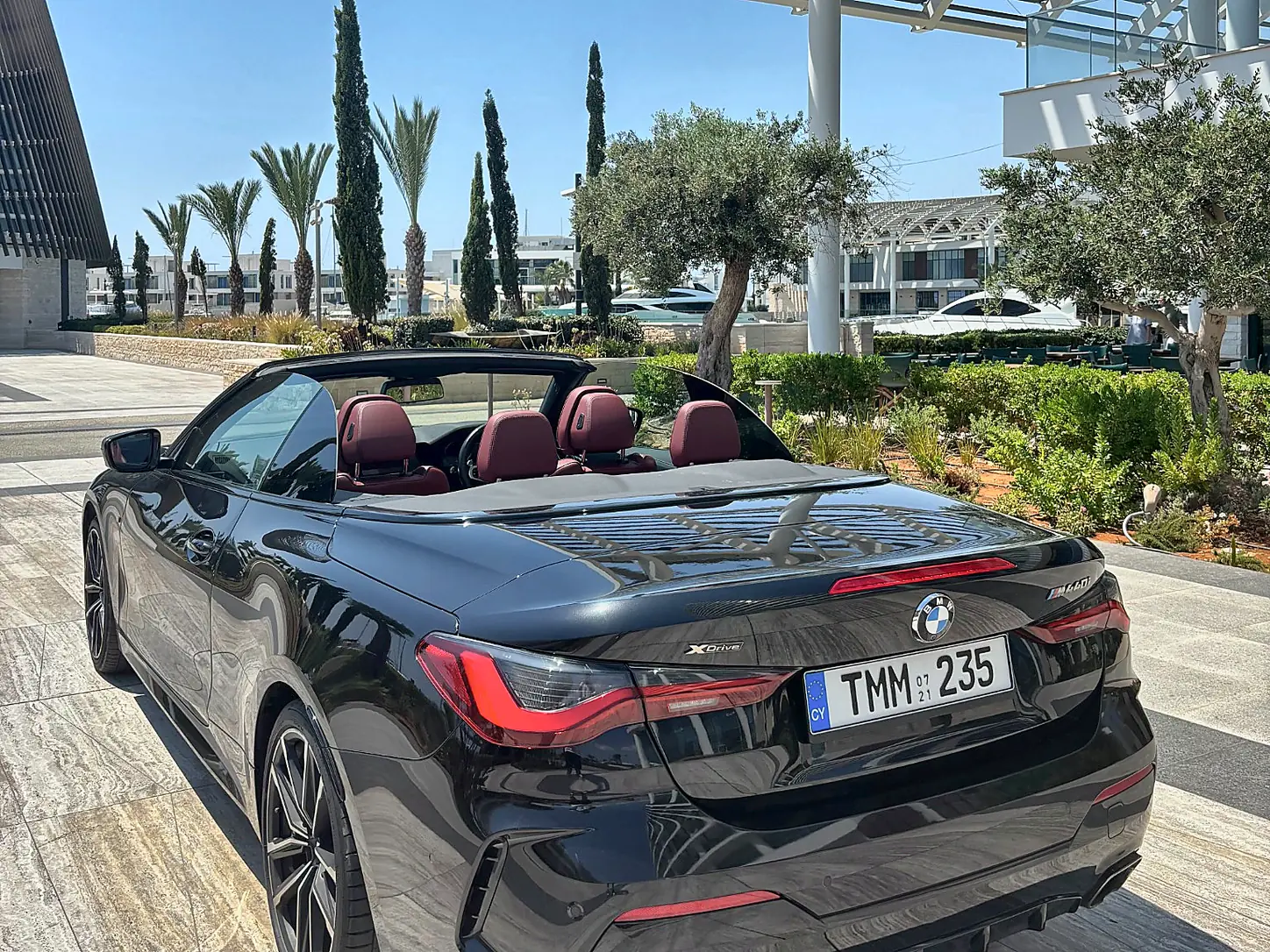 BMW M440i Cabrio - rear three-quarter view with roof open